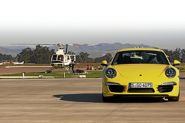 NOT that this Porsche 991 Carrera S is challenging the chopper to a race 
