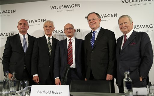 Newly appointed Volkswagen CEO Matthias Mueller, second from left, poses for a photograph with, from left, Bernd Osterloh, head of the workers' council, Berthold Huber, acting chairman of the supervisory board,, Stefan Weil, governor of German state Lower-Saxony and member of the supervisory board, and Wolfgang Porsche, member of the supervisory board, after a press statement following a meeting of Volkswagen's supervisory board in Wolfsburg, Germany, Friday, Sept. 25, 2015, after CEO Martin Winterkorn resigned on Wednesday amid an emissions scandal. AP