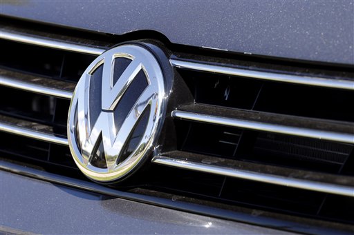 In this Thursday, Sept. 24, 2015, file photo, the grille of a Volkswagen car for sale is decorated with the iconic company symbol in Boulder, Colo. Germany's Volkswagen, already reeling from news that it had cheated on U.S. tests for nitrogen oxide emissions, said Tuesday, Nov. 3, that an internal investigation had revealed "unexplained inconsistencies" in the carbon dioxide emissions from 800,000 vehicles that could cost the company another 2 billion euros ($2.2 billion). The revelation comes after VW's admission in September that it rigged emissions tests for four-cylinder diesel engines on 11 million cars worldwide, including almost 500,000 in the U.S. It has already set aside 6.7 billion euros ($7.4 billion) to cover the costs of recalling those vehicles. (AP Photo/Brennan Linsley, File)