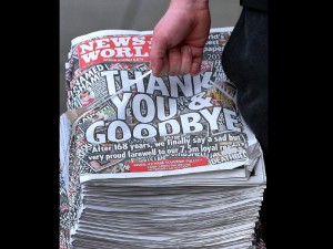 A bundle of the final copy of the News of the World newspaper are delivered to a shop in a shop in Stockport, England Sunday July 10, 2011. Britons are snapping up the last edition of Britain's best-selling Sunday tabloid News of the World, after the 168-year-old muckraking paper was brought down in a phone-hacking scandal. The 8,674th edition apologizes to readers for letting them down, saying "quite simply we lost our way" and acknowledging that "phones were hacked." AP PHOTO/Dave Thompson/PA Wire
