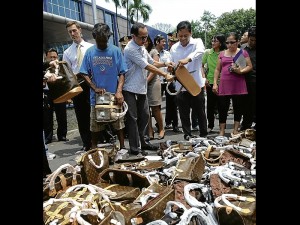 PHILIPPINE authorities slash and tear bogus products to mark World Anti-Counterfeit Day. According to global luxury brand Louis Vuitton, the price of imitation goods sold on the market may be low, but it exacts a higher cost on the children who help produce these illegal products.