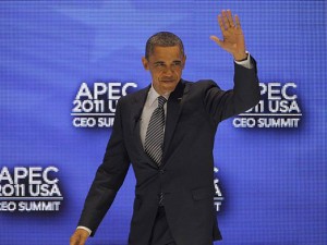 U.S. President Barack Obama waves to the audience before participating in a discussion at the APEC CEO Summit, a gathering of business leaders at the Asia-Pacific Economic Cooperation summit in Honolulu on Saturday, Nov. 12, 2011. ANDRES LEIGHTON/AP PHOTO