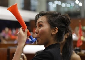 A Filipino trader blows a horn during the last day of trading this year at the Philippine Stock Exchange in the financial district of Makati, south of Manila, Philippines on Friday Dec. 28, 2012. The Philippine Stock Exchange index was up 0.31% or 17.84 points to close at 5,812.73. (AP Photo/Aaron Favila)