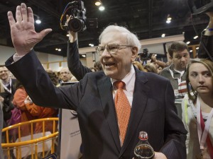 Investor Warren Buffett greets shareholders while touring the exhibit floor prior to holding the Berkshire Hathaway shareholders meeting, in Omaha, Neb., Saturday, May 4, 2013. Tens of thousands attend Berkshire Hathaway shareholders meetings to hear Buffett and Charlie Munger answer questions. No other annual meeting can rival Berkshire's, which is known for its size, the straight talk Buffett and Munger offer and the sales records shareholders set while buying Berkshire products. AP