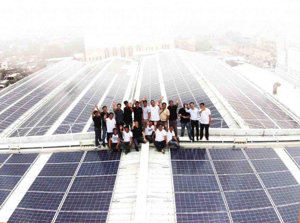 POWER OF THE SUN. The Solar Philippines team on the roof of Central Mall Biñan, the site of the first and largest own-use solar rooftop power plant in Southeast Asia.