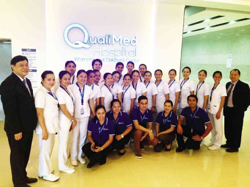 DOCTORS Mercado and Tupas, with the QualiMed medical staff