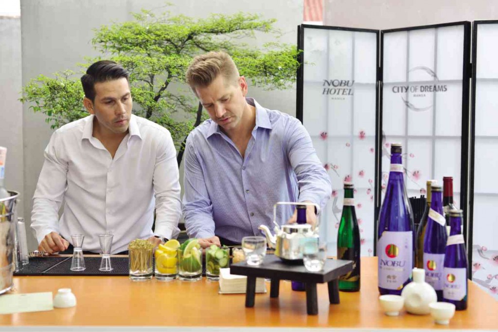 NOBU corporate beverage director Marcus Voglrieder (right) explains the attributes of Nobu’s signature drinks. 