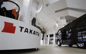 Child seats, manufactured by Takata Corp. are displayed at a Toyota Motor Corp.'s showroom in Tokyo Thursday, Nov. 6, 2014. Takata, the Japanese air bag maker embroiled in a massive recall totaling some 12 million vehicles globally, says it's taking more special losses for new recalls and will sink deeper into the red for the fiscal year. Takata said Thursday it will record a 25 billion yen ($218 million) loss for the fiscal year through March 2015. It previously forecast a 24 million yen ($210 million) forecast. (AP Photo/Shizuo Kambayashi)
