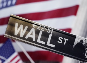 US stocks closed slightly higher Tuesday as investors continued to monitor talks between Greece and its creditors in hopes that a deal will be reached to keep the country from falling out of the eurozone.  AP PHOTO/MARK LENNIHAN