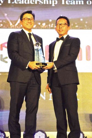 TAN receives an award for IMI as Technology Company of the Year during the Asia CEO Awards 2013.