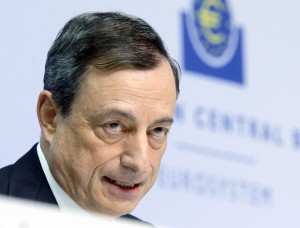 In this Thursday, Jan. 22, 2015 photo, President of European Central Bank Mario Draghi speaks during a news conference in Frankfurt, Germany, following a meeting of the ECB governing council. Draghi delivered on a pledge to do whatever it takes to pull Europe out of a deep and prolonged slump. The central bank will buy 1.1 trillion euros ($1.3 trillion) worth of government and corporate bonds through September 2016 _ longer if necessary _ to shrink the euros value, boost exports and encourage borrowing, spending and hiring. (AP Photo/Michael Probst)