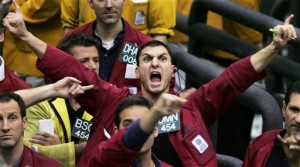 In this March 22, 2005, file photo, Damon Federighi shouts orders in the euro dollar futures pit at the Chicago Mercantile Exchange. The Dow on Thursday, Feb. 6, 2015, finished more than 200 points higher on surging oil prices and merger activity and as investors awaited Friday's closely watched US jobs report.  AP PHOTO/M. SPENCER GREEN