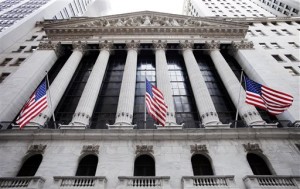 American flags fly in front of the New York Stock Exchange, in New York. US stocks posted solid gains Thursday, rallying on news of a ceasefire in Ukraine as strong earnings from Cisco lifted the technology sector.  AP PHOTO/MARK LENNIHAN 