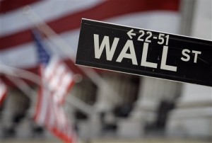  This May 11, 2007 file photo shows a Wall Street sign in front of the flag-draped facade of the New York Stock Exchange. US stocks are edging higher Thursday, April 2, 2015, as the market shakes off two days of losses. AP