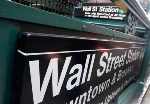 This Oct. 2, 2014 file photo shows the Wall Street subway stop on Broadway, in New York's financial district. US stocks snapped Monday, April 27, 2015, a three-day rally to record highs as investors awaited Apple earnings results and a Federal Reserve policy meeting.  AP PHOTO/RICHARD DREW 