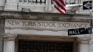 This Oct. 2, 2014, file photo shows the Wall Street entrance of the New York Stock Exchange, in New York. Wall Street stocks finished lower Wednesday, April 29, 2015, on news the US economy grew just 0.2 percent in the first quarter.  AP PHOTO/RICHARD DREW