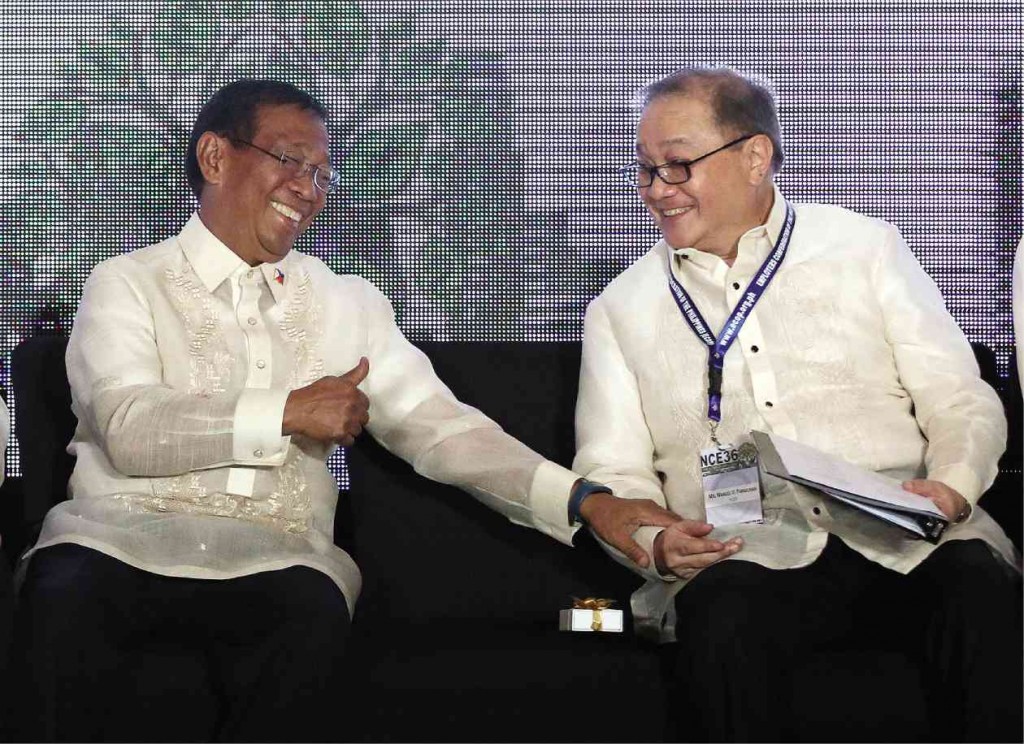 THUMBS UP  Binay in high spirits and victory mode  as he talks with business tycoon  Manuel V. Pangilinan at  the 36th National Conference of Employers in Pasay City on Friday. MARIANNE BERMUDEZ