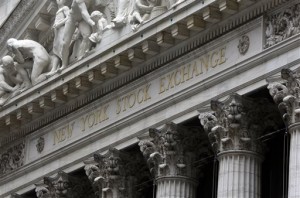 This Oct. 2, 2014, file photo shows the facade of the New York Stock Exchange, in New York. US stocks finished mostly lower Wednesday, May 20, 2015, after a short-lived jump that came when the Federal Reserve's policy meeting minutes cast doubt on an interest rate hike in June.  AP PHOTO/RICHARD DREW 