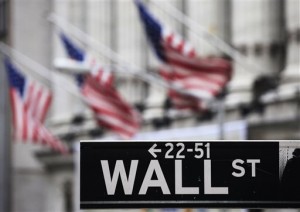This April 22, 2010, file photo shows a Wall Street sign in front of the New York Stock Exchange. The S&P 500 bolted to a fresh record-high close Thursday, led by strong gains in Apple, Facebook and other technology stocks.  AP PHOTO/MARK LENNIHAN