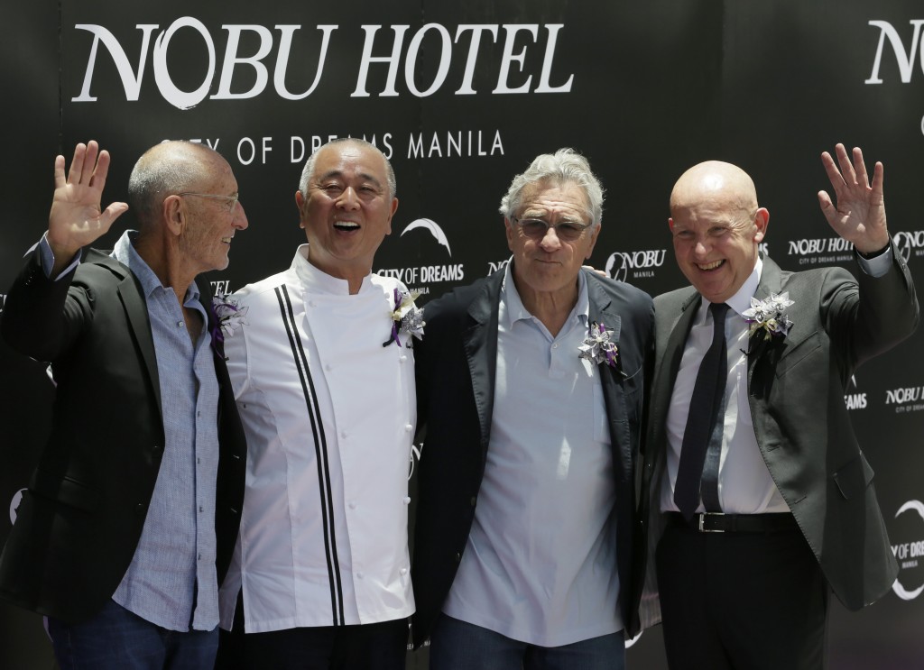 From right, Trevor Horwell, CEO of Nobu Hospitality, Hollywood actor Robert De Niro, Japanese culinary Chef Nobu Matsuhisa and Hollywood film producer Meir Teper pose during the ribbon-cutting ceremony at the opening of the Nobu Hotel at the City of Dreams Casino Monday, May 18, 2015 at suburban Pasay city, south of Manila, Philippines.  Robert de Niro and his business partners have formally opened Asia's first Nobu Hotel in Manila as the luxury brand gears up for global expansion. AP