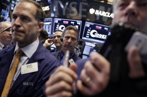 Traders gather at a post on the floor of the New York Stock Exchange Thursday, May 7, 2015. US stocks rose moderately Thursday in relatively quiet trading, a contrast to the heavy selling that occurred a day earlier when Federal Reserve Chair Janet Yellen suggested that stock prices might be too high.  AP PHOTO/RICHARD DREW
