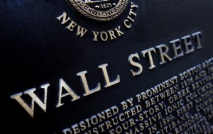This Jan. 4, 2010, file photo shows an historic marker on Wall Street in New York. Wall Street stocks finished little changed Wednesday in choppy trade following a lackluster US retail sales report and disappointing earnings from Macy's.   AP PHOTO/MARK LENNIHAN