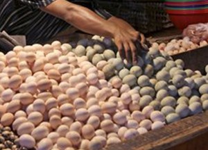 A vendor arranges eggs as he waits for customers at his stall at a market in Jakarta, Indonesia, Tuesday, April 29, 2014. (AP Photo/Tatan Syuflana)