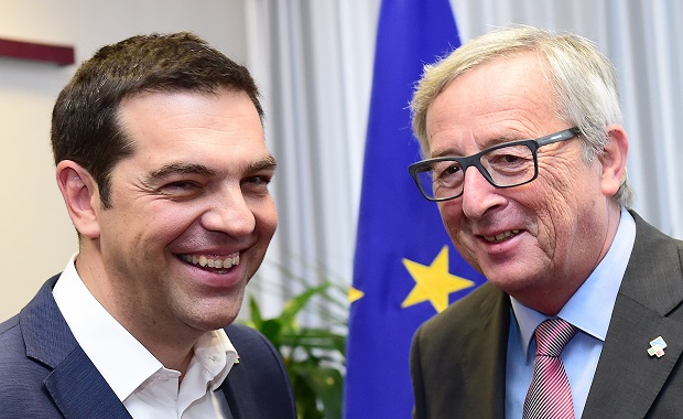 Greek Prime Minister Alexis Tsipras, left, and European Commission President Jean-Claude Juncker participate in a bilateral meeting on the sidelines of the EU-CELAC summit in Brussels on Thursday, June 11, 2015. Greek Prime Minister Alexis Tsipras continued his diplomatic offensive on Thursday to try to convince European creditors to pay out the bailout loans the country needs to avoid default. (AP Photo/Emmanuel Dunand/Pool Photo via AP)