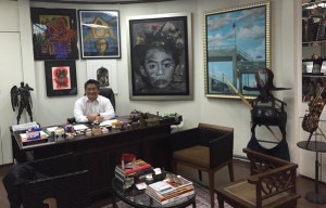8990 Holdings prexy JJ Atencio at his artwork-laden office in Mandaluyong
