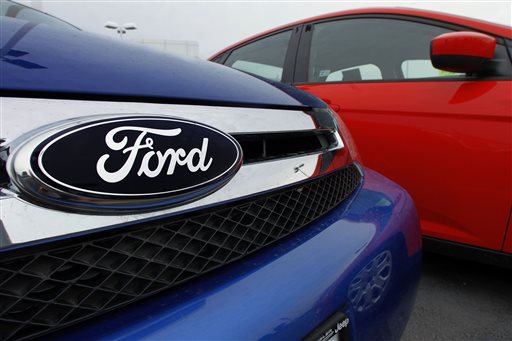 Ford logo on a vehicle at a Ford dealership in Springfield, Ill. AP