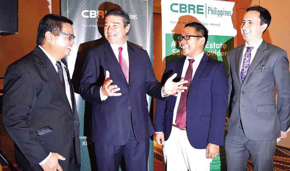 SANTOS (second from left) shares a light moment with CBRE Philippines’ Global Research & Consultancy Group head Jan Custodio (left), Investment Properties & Capital Markets team manager Kash Salvador and Corporate Agency & Brokerage department director Morgan McGilvray as the firm celebrates its 20th year at Fairmont Hotel in Makati.ROMY HOMILLADA