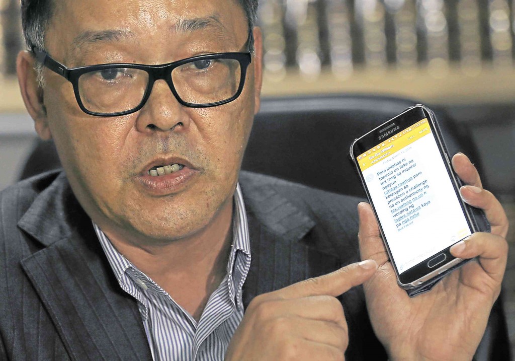 BATTLE OF LAWYERS Ramon Esguerra shows a text message of his client William Go in Makati City on Friday. At right, Ferdie Topacio says Maia Santos-Deguito will explain her side at the proper time and venue.      RAFFY LERMA