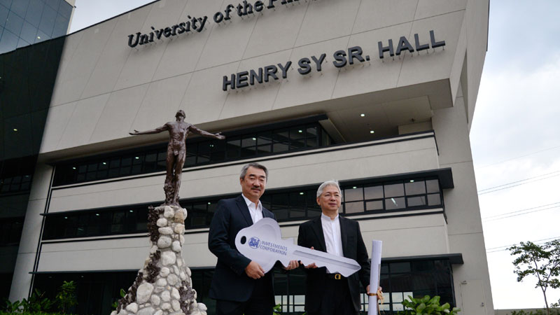 UP AT BGC   SM Prime Holdings president Hans Sy (left) turns over  to UP president Alfredo Pascual the P400-million, nine-level University of the Philippines Bonifacio Global City building in Taguig City. ELOISA LOPEZ