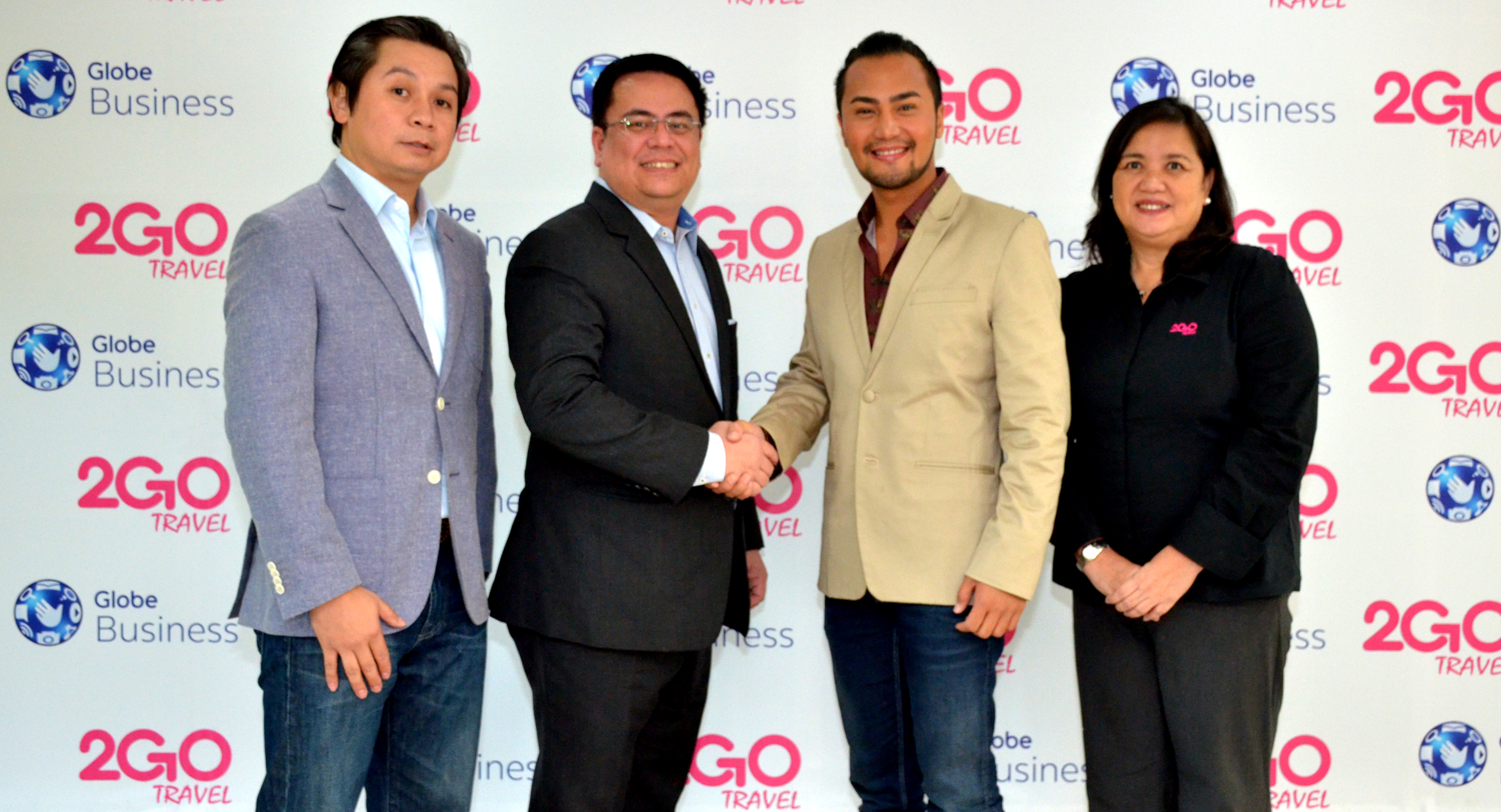 Sealing the partnership are 2Go Travel Senior Vice President Stephen Tagud (2nd from right) and With Globe Enterprise Sales Vice President Dion Asencio (2nd from left). With them are MYNT AVP for Business Development Jose Luigi Reyes (leftmost) and 2Go Travel VP for Retail Sales Grace Golez (rightmost).