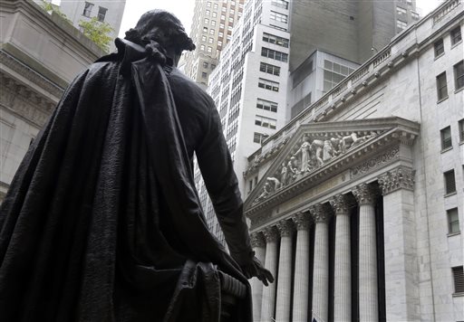 In this Oct. 2, 2014, file photo, the statue of George Washington on the steps of Federal Hall faces the facade of the New York Stock Exchange. U.S. stock indexes moved mostly higher in early trading Tuesday, April 19, 2016, as investors pored through the latest batch of company earnings. Mining and energy companies were among the biggest gainers, while technology stocks lagged the most. Oil prices rebounded. (AP Photo/Richard Drew, File)