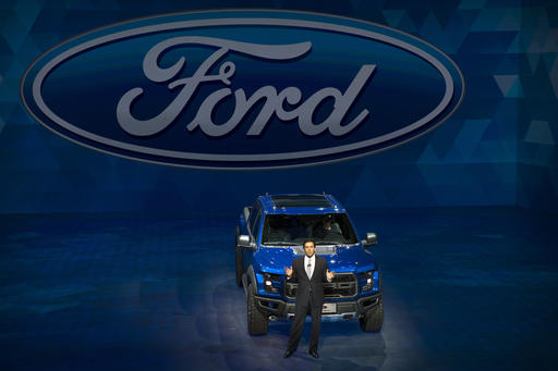 Ford CEO Mark Fields speaks in front of a Ford F-150 Raptor pickup truck at a promotional event for Ford ahead of the biennial Auto China car show in Beijing, Saturday, April 23, 2016. AP