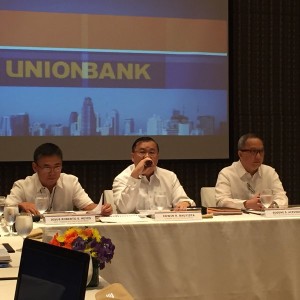 Union Bank president Edwin Bautista (center) at press briefing after the stockholders meeting