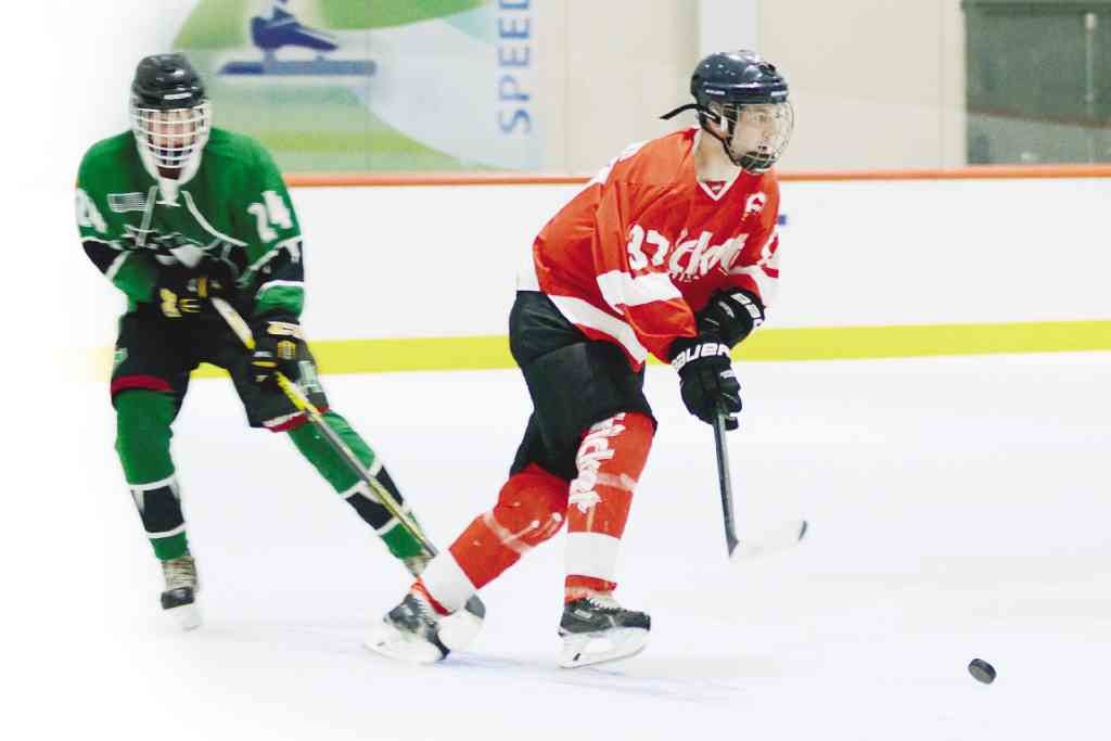 MANULIFE’S top executive, 36-year-old Ryan Charland (in red jersey), is also promoting ice hockey in tropical Manila.