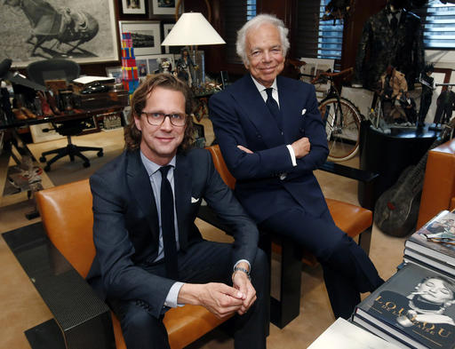 FILE - In this Tuesday, Sept. 29, 2015, file photo, designer Ralph Lauren, right, poses in his office with Stefan Larsson, global brand president for Old Navy, in New York. Ralph Lauren Corp. said Tuesday, June 7, 2016, it plans to close stores, focus on its more popular brands and remove layers of its management team to save costs. The shakeup comes seven months after the fashion company hired new CEO Larsson to reverse falling profits. (AP Photo/Jason DeCrow, File)