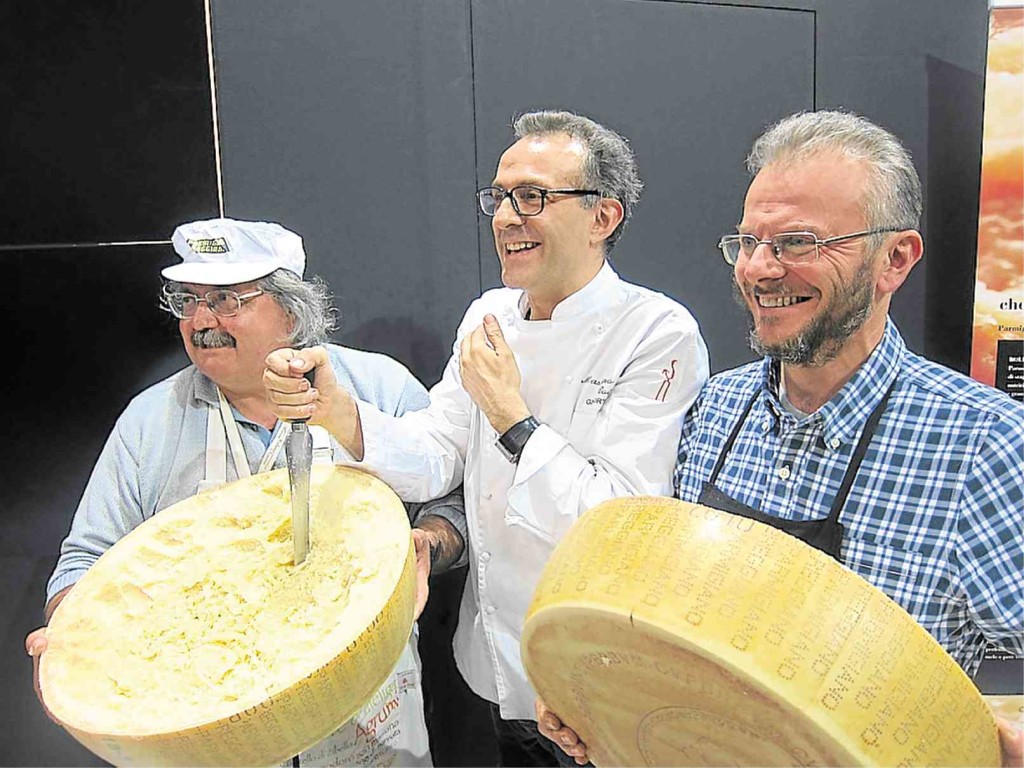 CHEF Massimo Bottura (center) promotes Parmigiano Reggiano at the Salone del Gusto.    PHOTOS BY MARGAUX SALCEDO