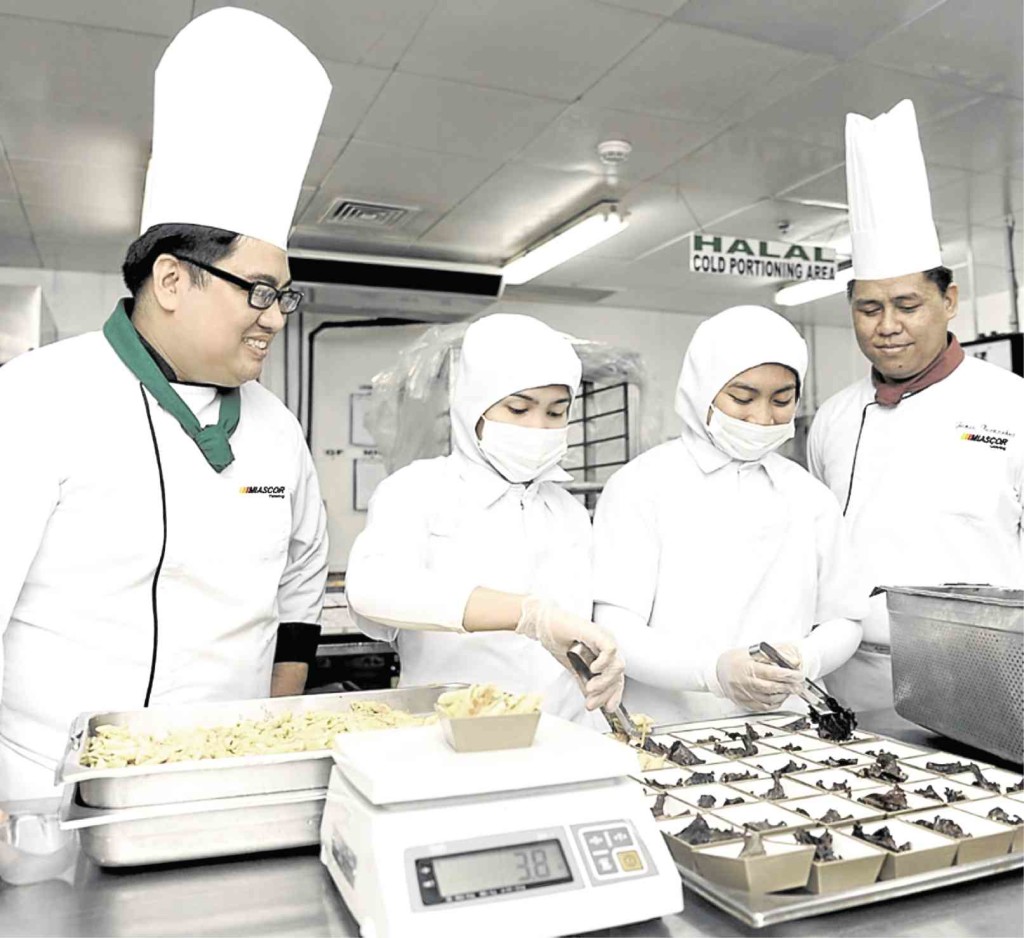 CHEFS monitor food preparation at the halal-exclusive section of Miascor’s labyrinth-like kitchen