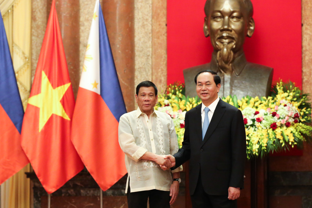 President Rodrigo Duterte shakes hands with Vietnamese President Tran Dai Quang at the State Palace in Hanoi on September 29. KING RODRIGUEZ/ Presidential Photo