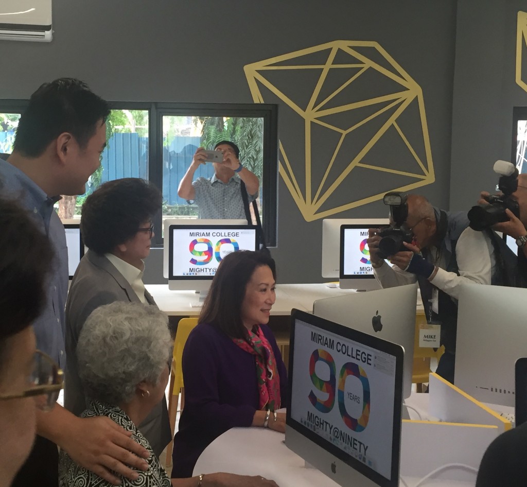 Maryknoll/Miriam College alumna Betty Sy tests equipment at the innovation hub donated by her family