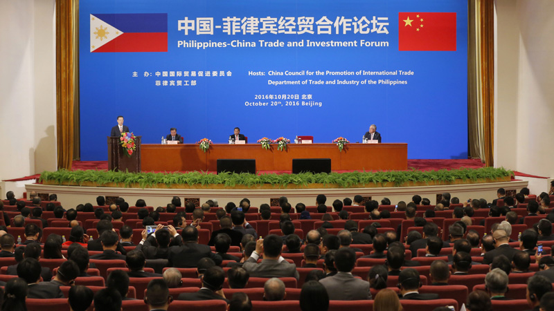 Chinese Vice-Premier Zhang Gaoli, left, speaks as Philippine President Rodrigo Duterte, third from left, listens during the Philippines-China Trade and Investment Forum at the Great Hall of the People in Beijing Thursday, Oct. 20, 2016. China and the Philippines have agreed to resume a dialogue on their dispute over the South China Sea, a senior Chinese diplomat said Thursday following talks between the countries' leaders. (Wu Hong/Pool Photo via AP)