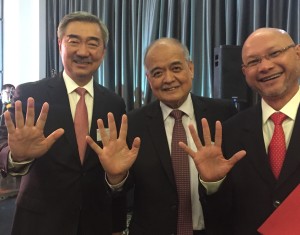 China Bank chair Hans Sy, president Ricardo Chua and senior vice president Alex Escucha give the number 5 sign to indicate the number of times the bank has won a Bell award  
