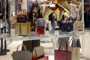 Chinese shopper looking at handbags Nov 2016