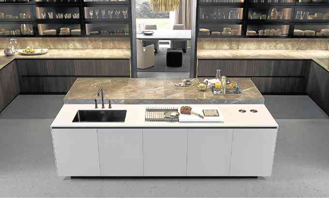 The Varenna Kitchen island features a multilevel nook, pull up socket, chopping board with weighing accessory.