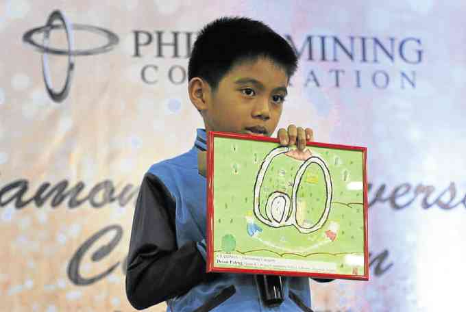 Devon Paleng, 10 years old and a grade 4 pupil of Lab-ang Community School in Barangay Ampucao, Itogon, Benguet, won the top prize in a poster-making contest. 