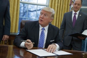 Donald Trump signs executive order canceling TPP - 23 Jan 2017