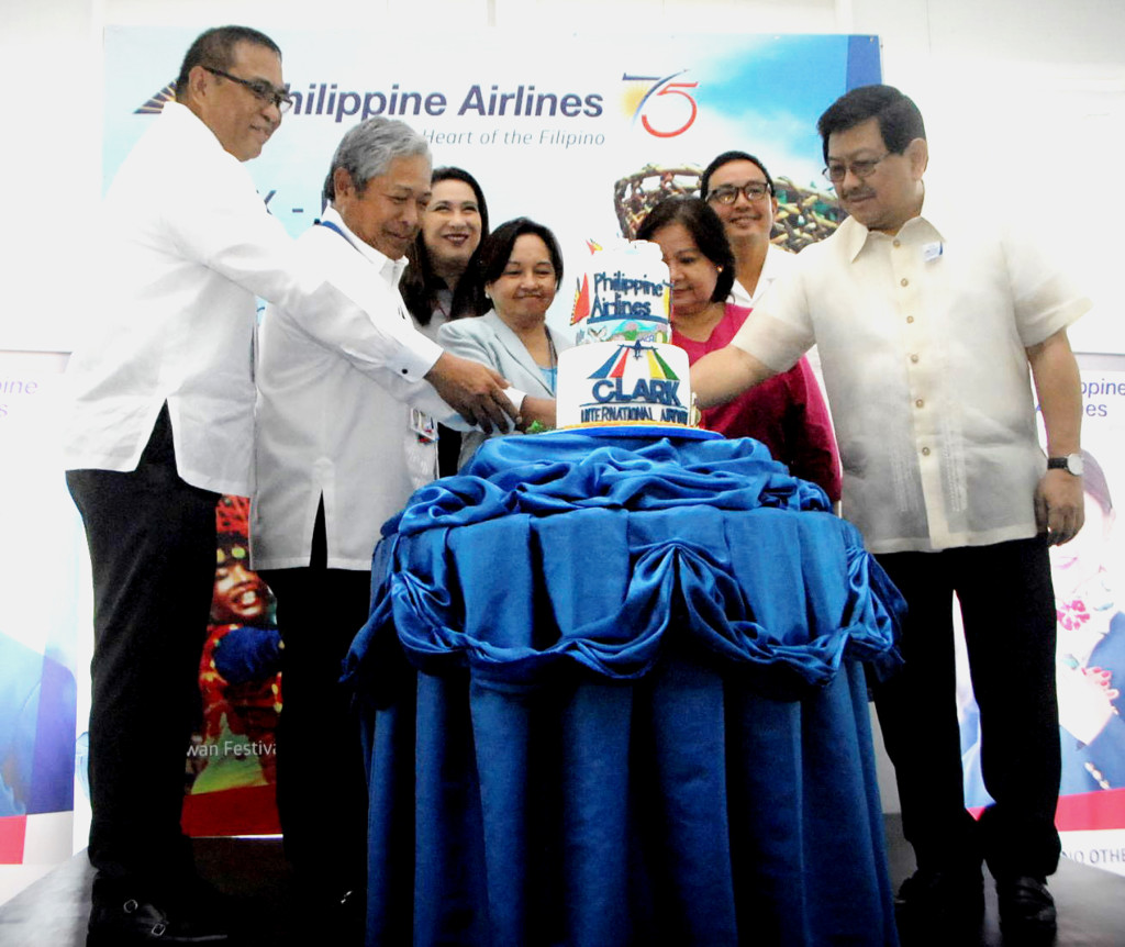To celebrate Philippine Airlines' (PAL) inaugural flight from Clark International Airport to Davao non-stop, a special cake was cut by (from left) Clark Airport Pres. Alex Cauguiran; PAL Pres. Jaime J. Bautista; PAL VP-Marketing Ria Domingo; former President & now Pampanga Rep./Deputy Speaker Gloria Macapagal-Arroyo; Pampanga Governor Lilia Pineda; PAL Sr. VP for Airline Operations Ismael Augusto Gozon; and Angeles City Mayor Edgardo Pamintuan. The three times weekly service is one of four new routes PAL is opening from Clark – to Cebu, Davao, Puerto Princesa & Busuanga – utilizing the 199-seater Airbus A321 jet. PAL PHOTO